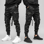Front view of men’s ribbon harem cargo joggers with elastic waist and streetwear style