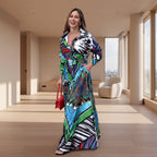 Woman wearing a colorful patterned dress standing on a sidewalk.