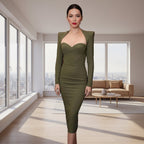 Person wearing a green dress in an indoor setting