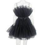 Black tulle dress on a mannequin against a white background